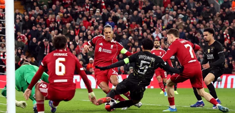 Liverpool players defending against Paris Saint Germain