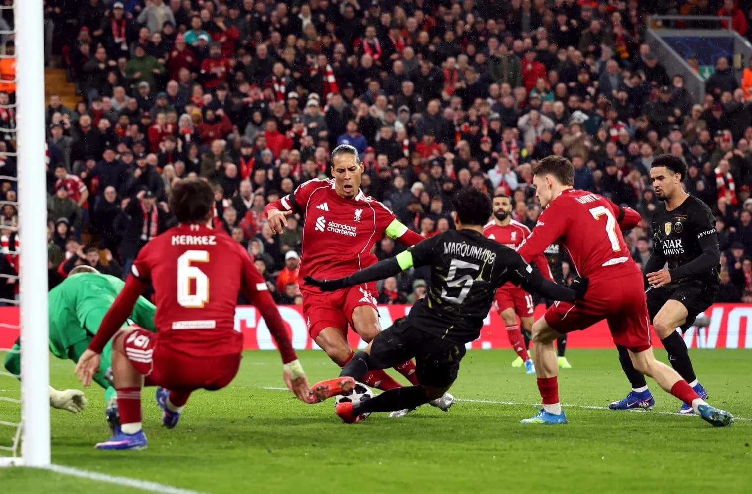 Liverpool players defending against Paris Saint Germain