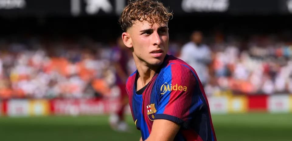 Young player in Barcelona jersey on the field