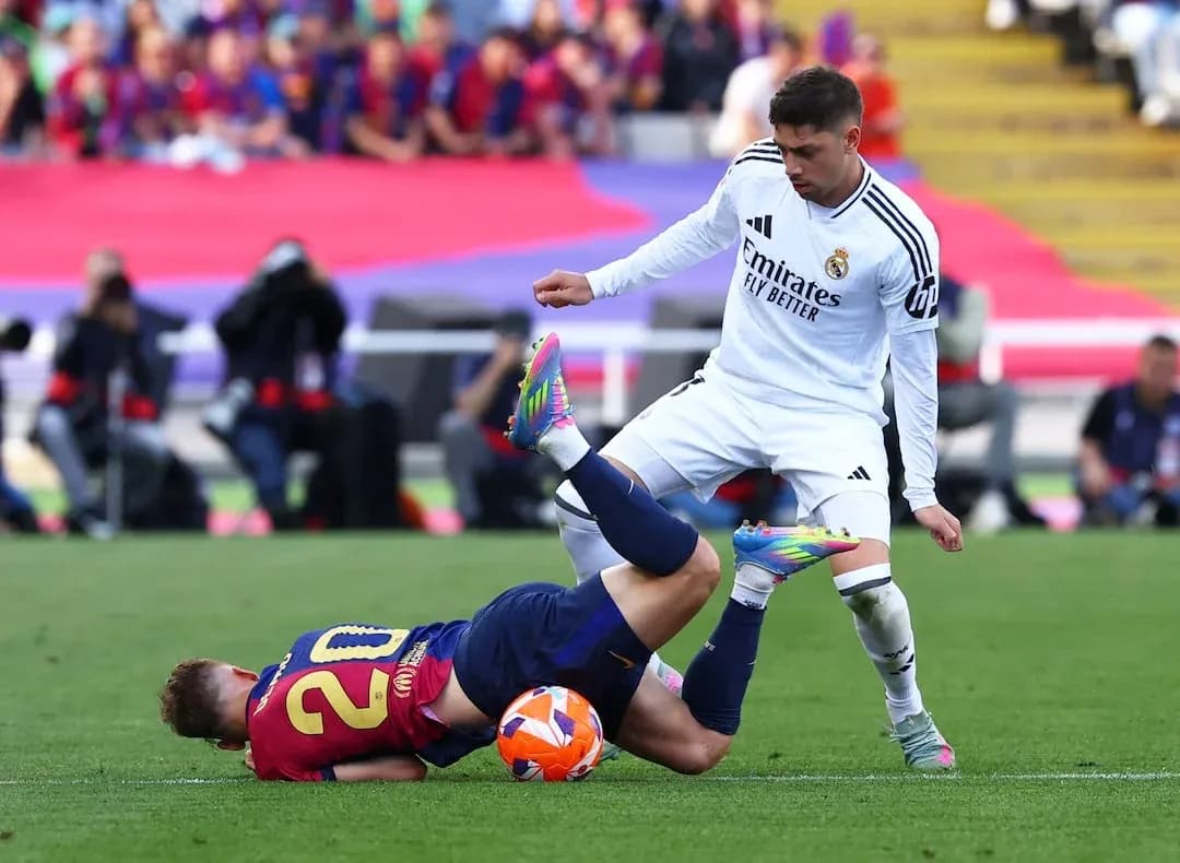 Barcelona player on the ground during El Clasico