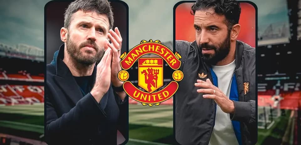 Two coaches discussing tactics at Manchester United stadium