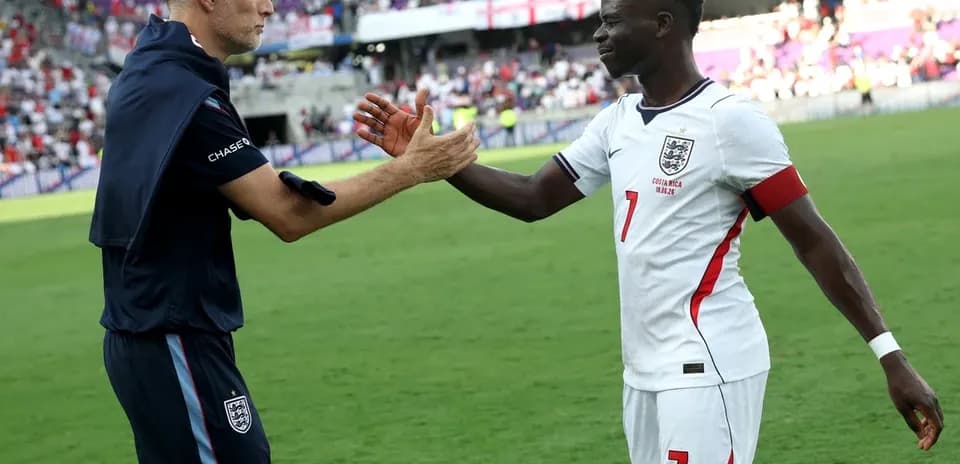 Coach and player shaking hands after match