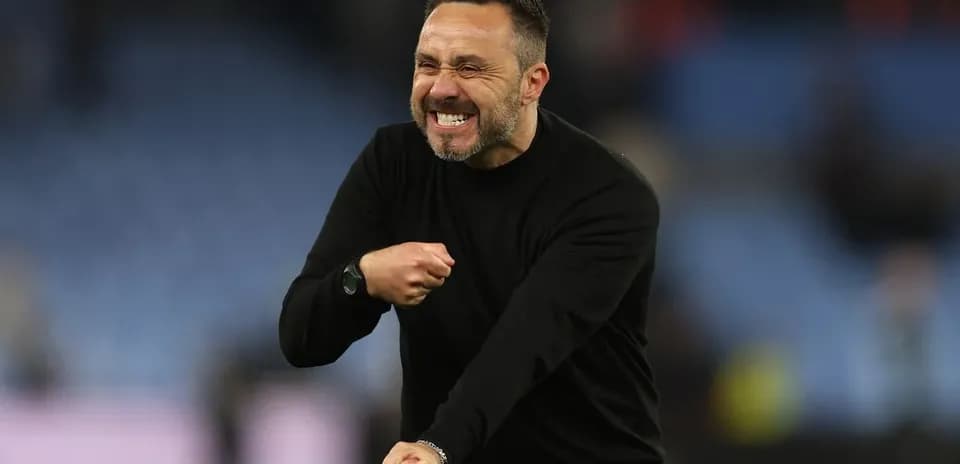Coach celebrating enthusiastically on the sideline