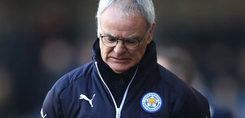 Manager walking with head down on sideline