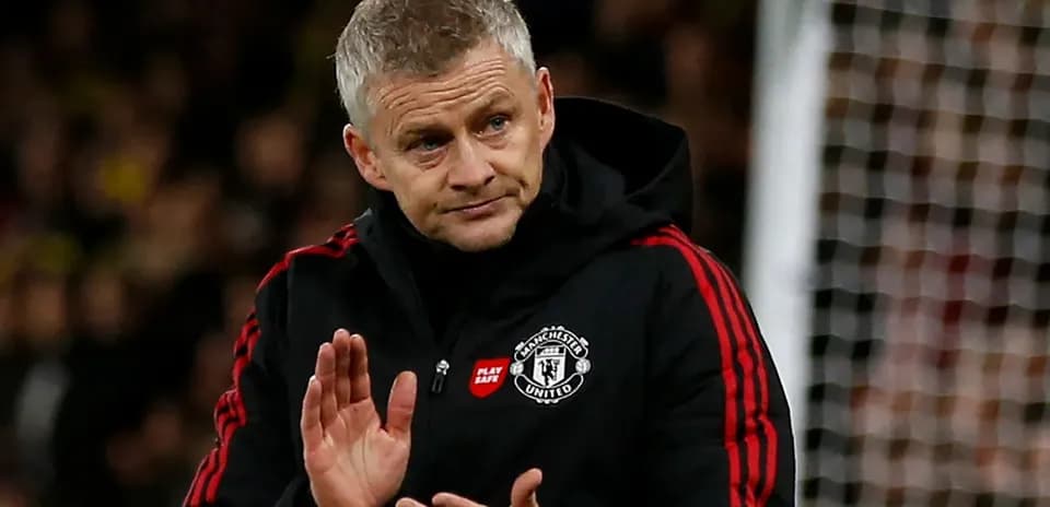 Manager gesturing during match on the sidelines