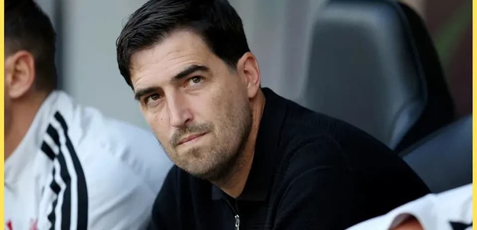 Coach observing from the sidelines during match