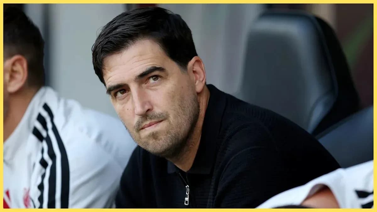 Coach observing from the sidelines during match