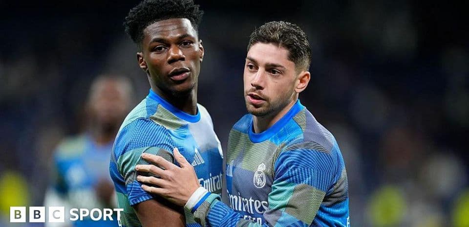 Two Real Madrid players celebrating on the pitch