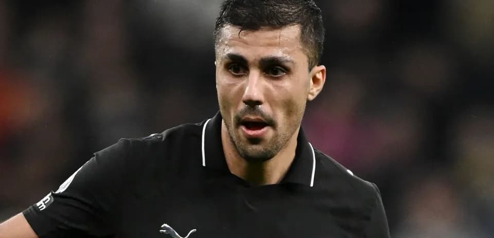 Player in black kit during match action
