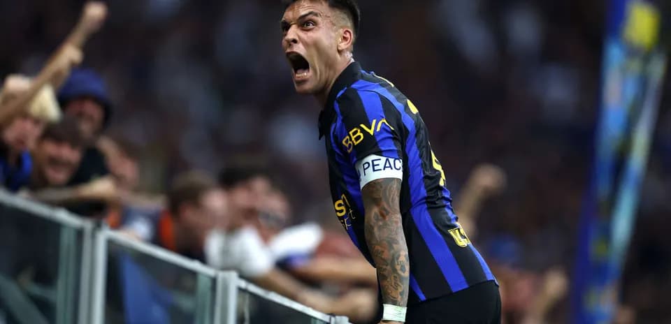 Lautaro Martinez celebrating with fans after a goal