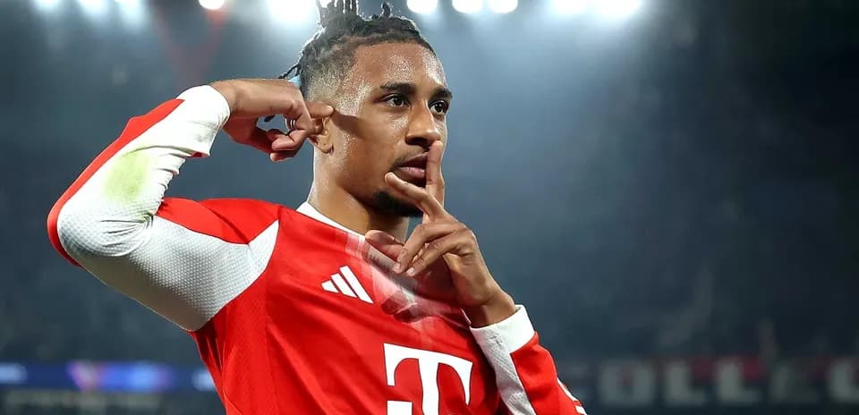 Player celebrating goal with shushing gesture