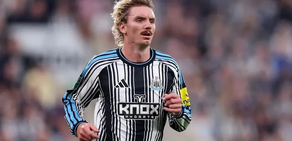 Newcastle player running on the field during match