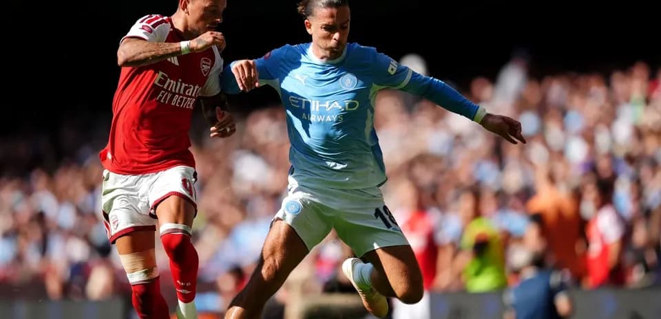 Two players contesting for the ball during match
