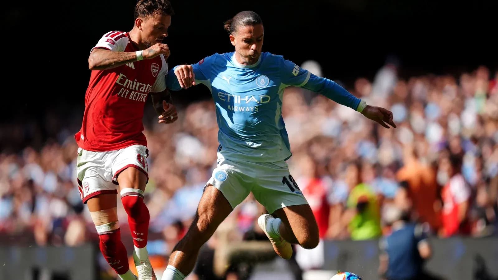 Two players contesting for the ball during match