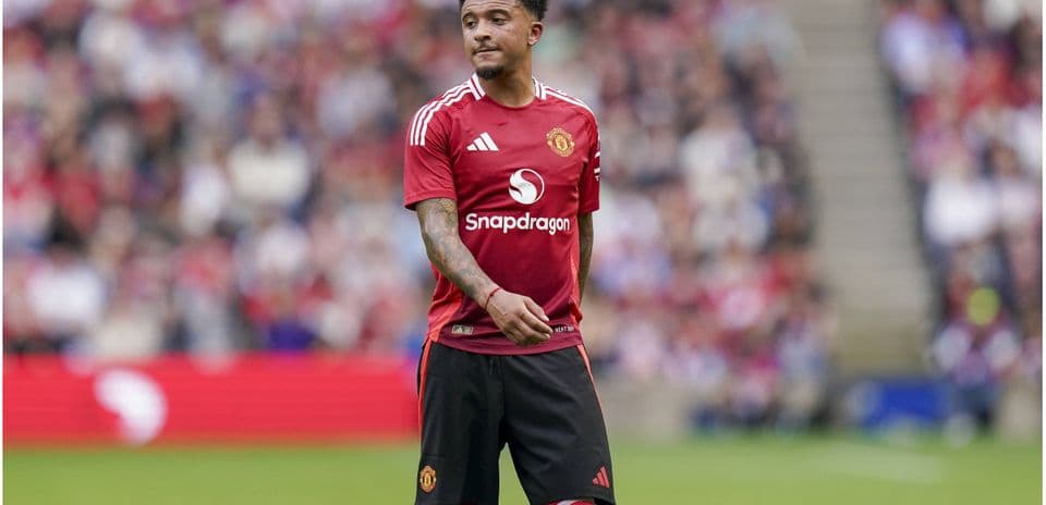 Jadon Sancho in Manchester United kit on pitch