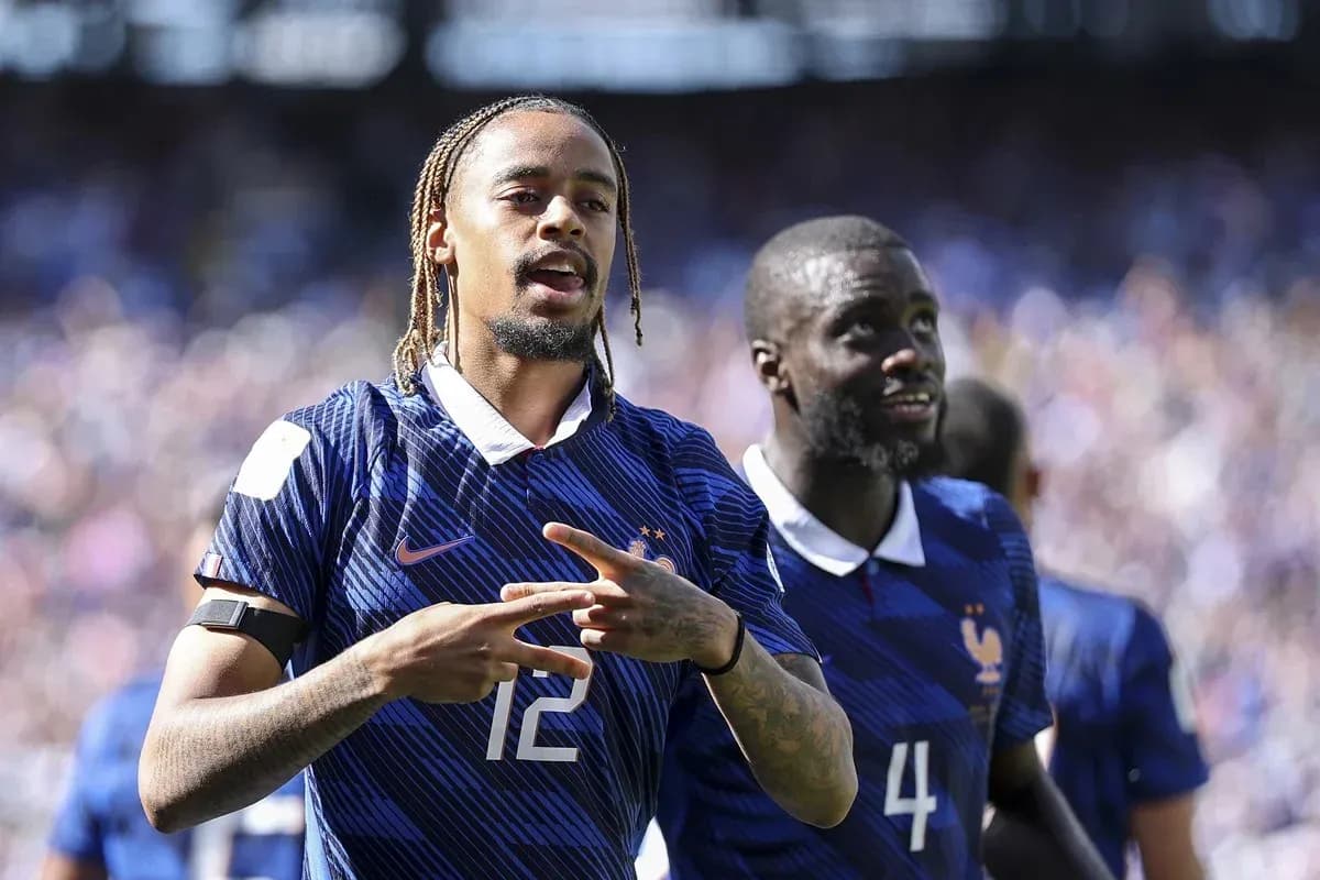Two France players celebrating during a match