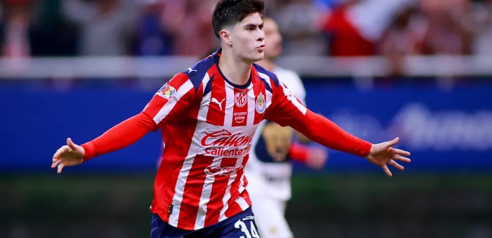Chivas player celebrating a goal during Liga MX match