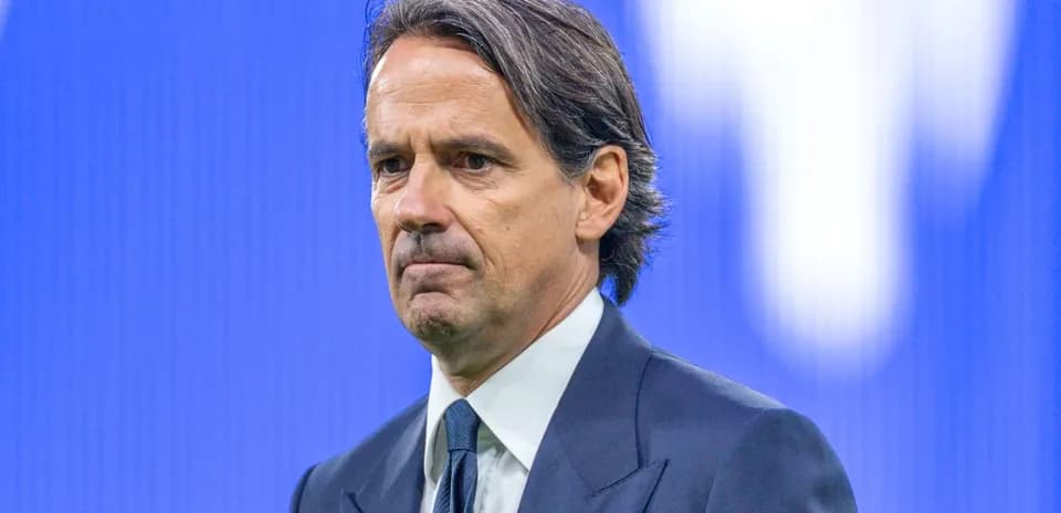 Coach in formal attire during press conference setting
