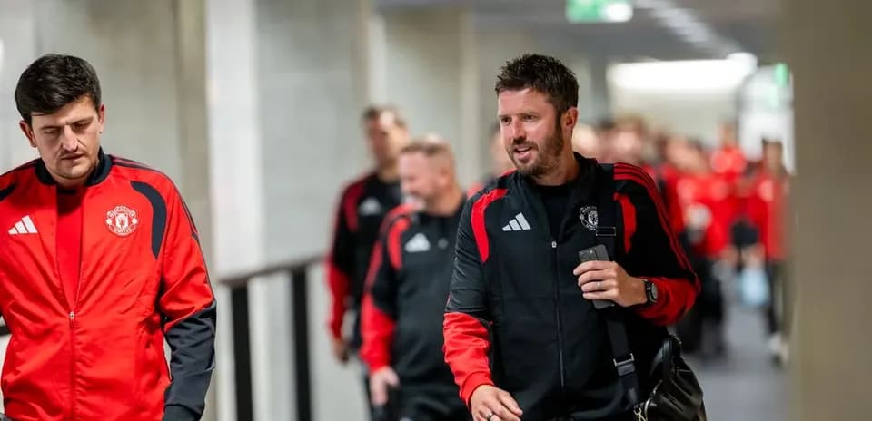 Manchester United team walking through a corridor