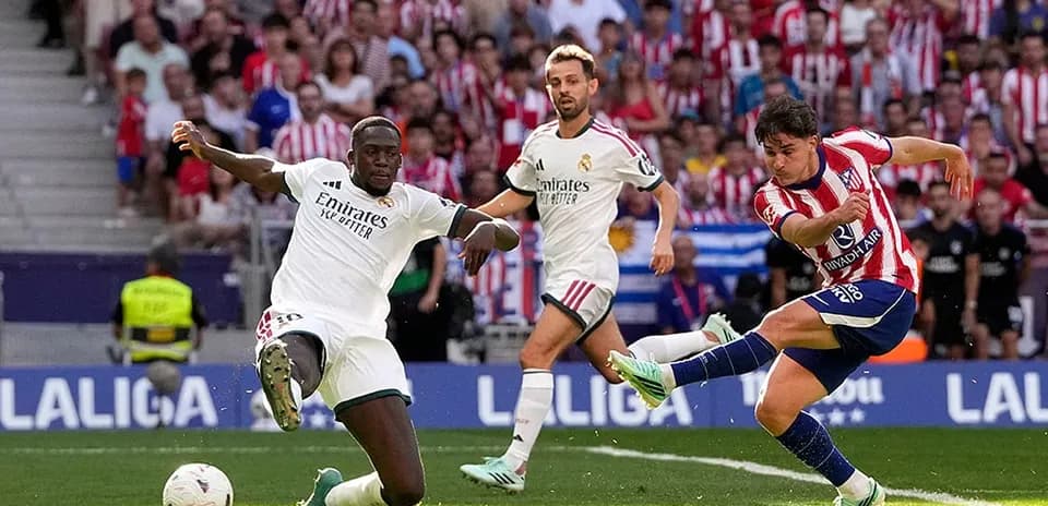 Atletico Madrid player shooting during match