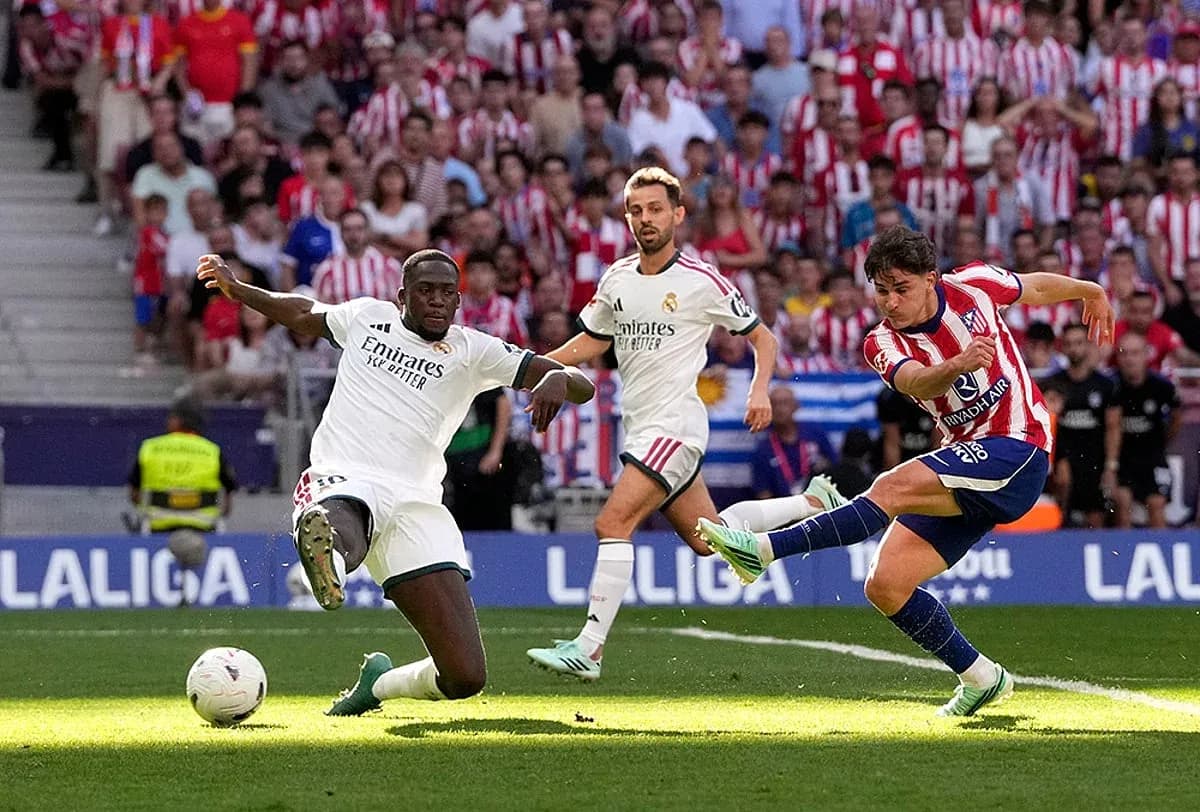 Atletico Madrid player shooting during match