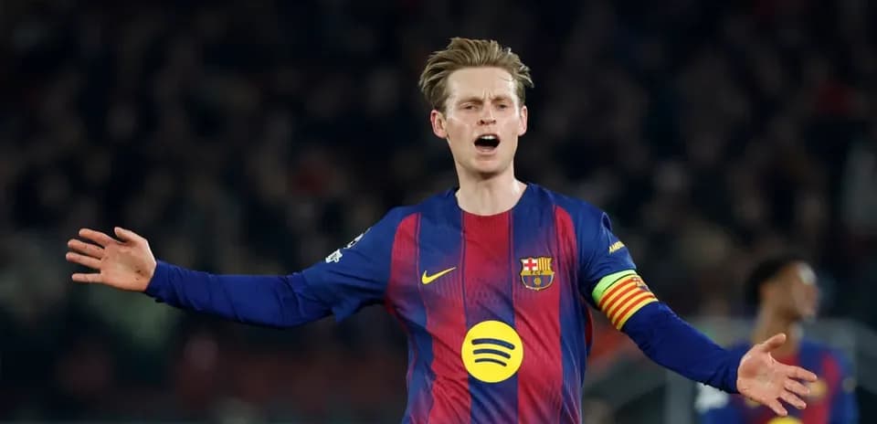 Player gesturing during a match wearing Barcelona jersey