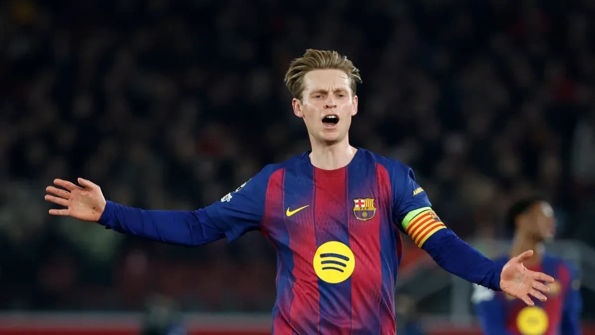 Player gesturing during a match wearing Barcelona jersey