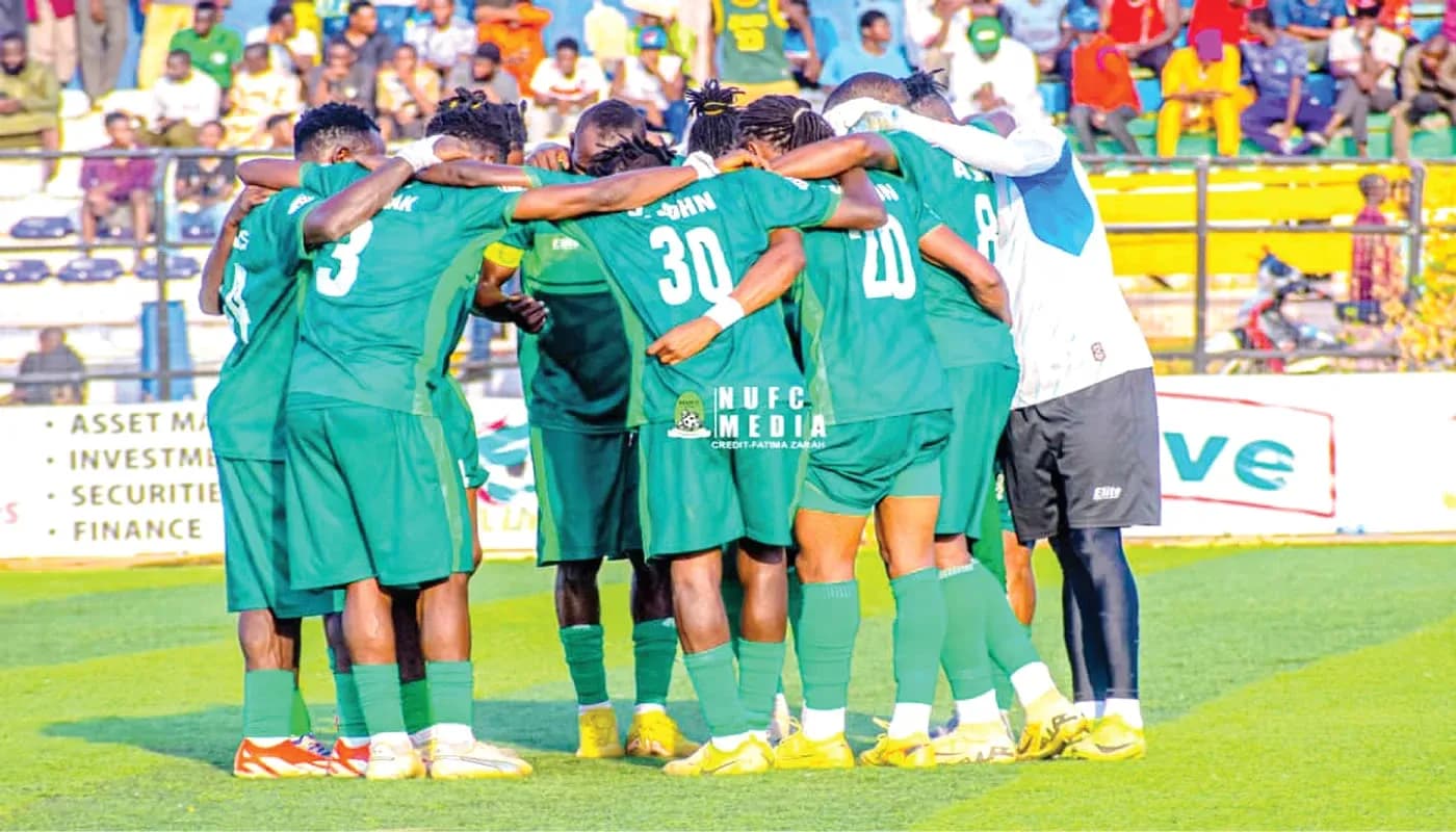Nasarawa United players in a team huddle