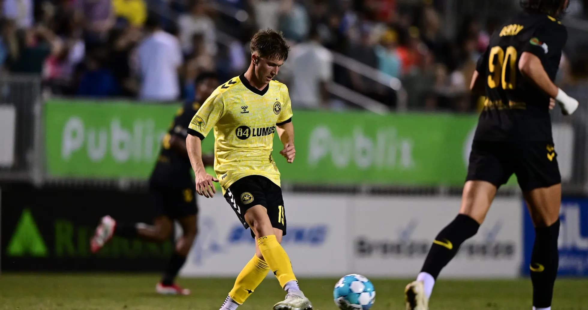 Player kicking ball during Charleston Battery match