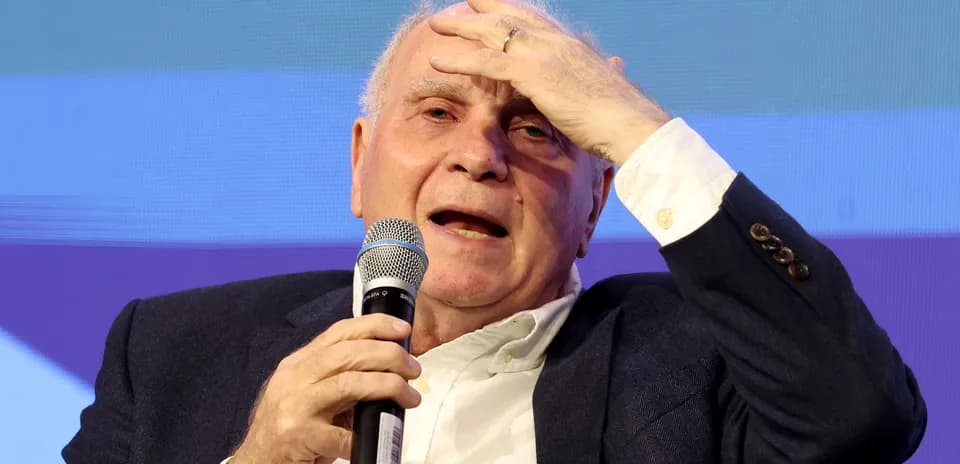 Speaker holding microphone at event discussion