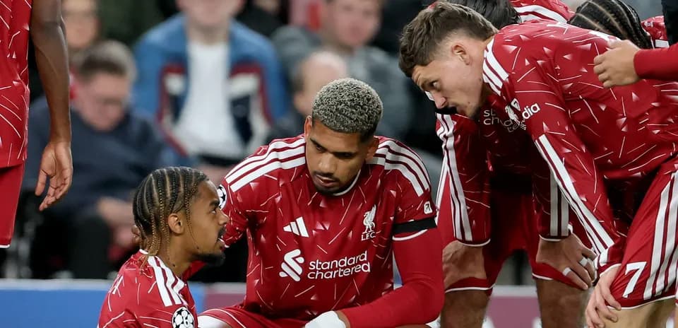 Liverpool players discussing strategy during a match