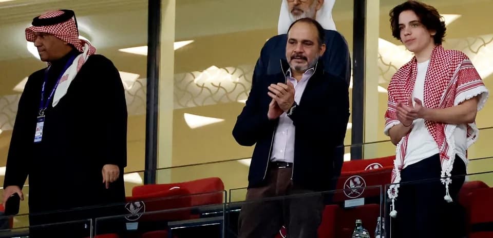 Spectators applauding in stadium viewing area