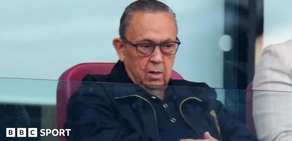 Man watching match from VIP box at stadium