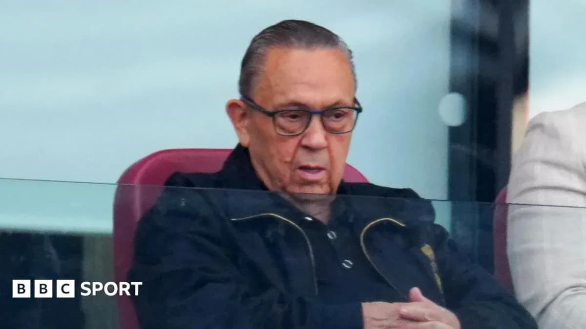 Man watching match from VIP box at stadium
