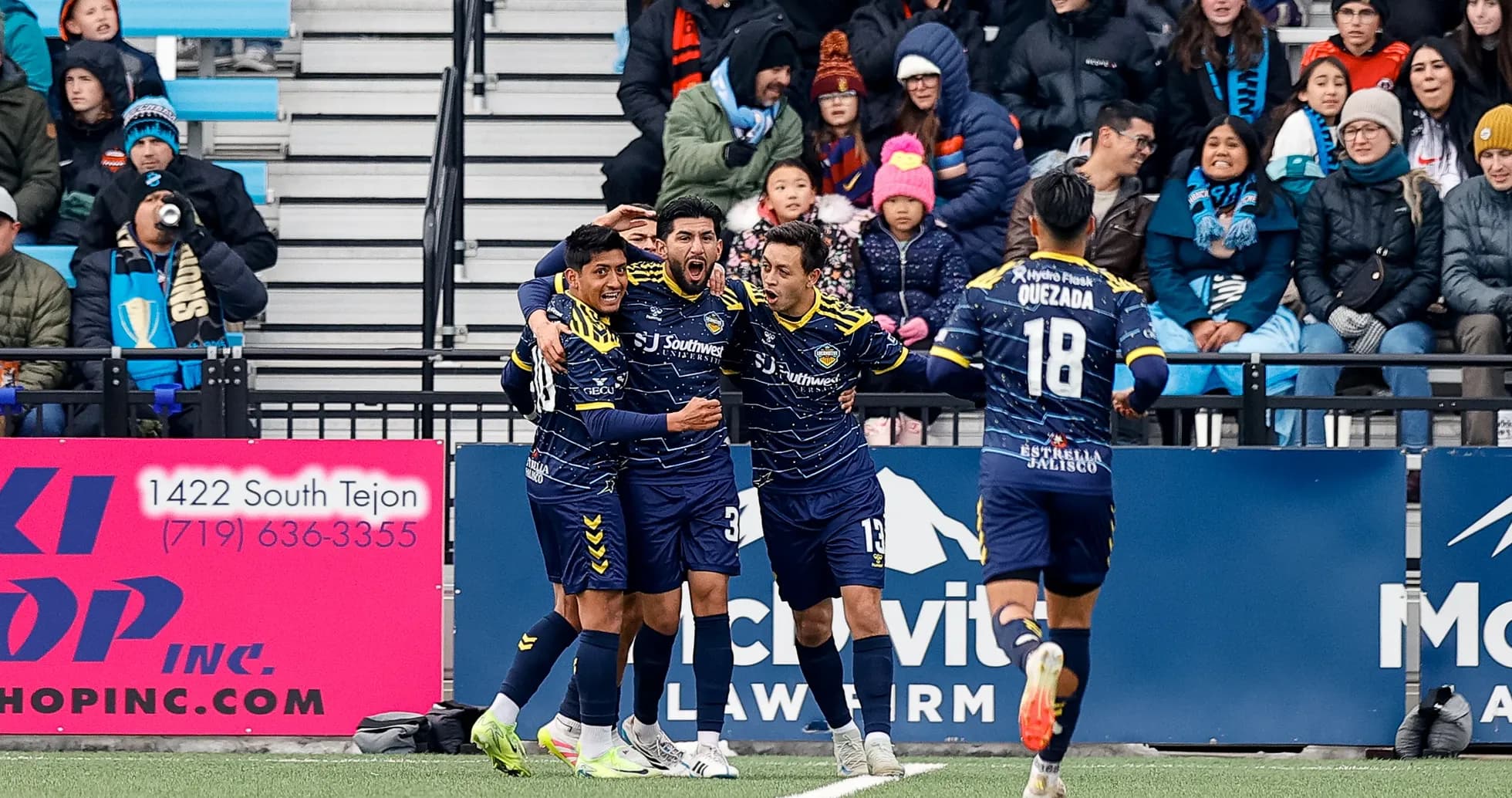 Players celebrating a goal during USL match