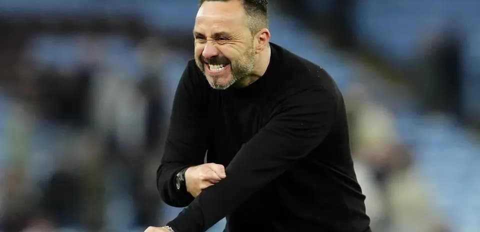 Coach celebrating passionately during a match