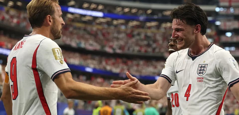 Harry Kane and Declan Rice celebrating on the pitch