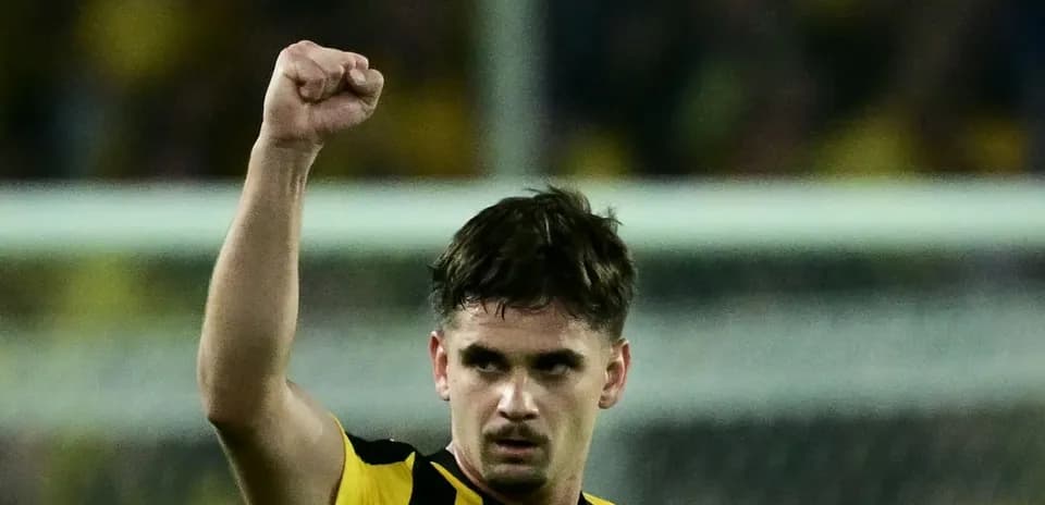 AEK Athens player celebrating during match