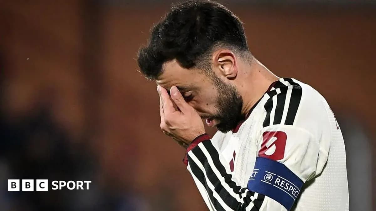 Player holding his head in disappointment on the field