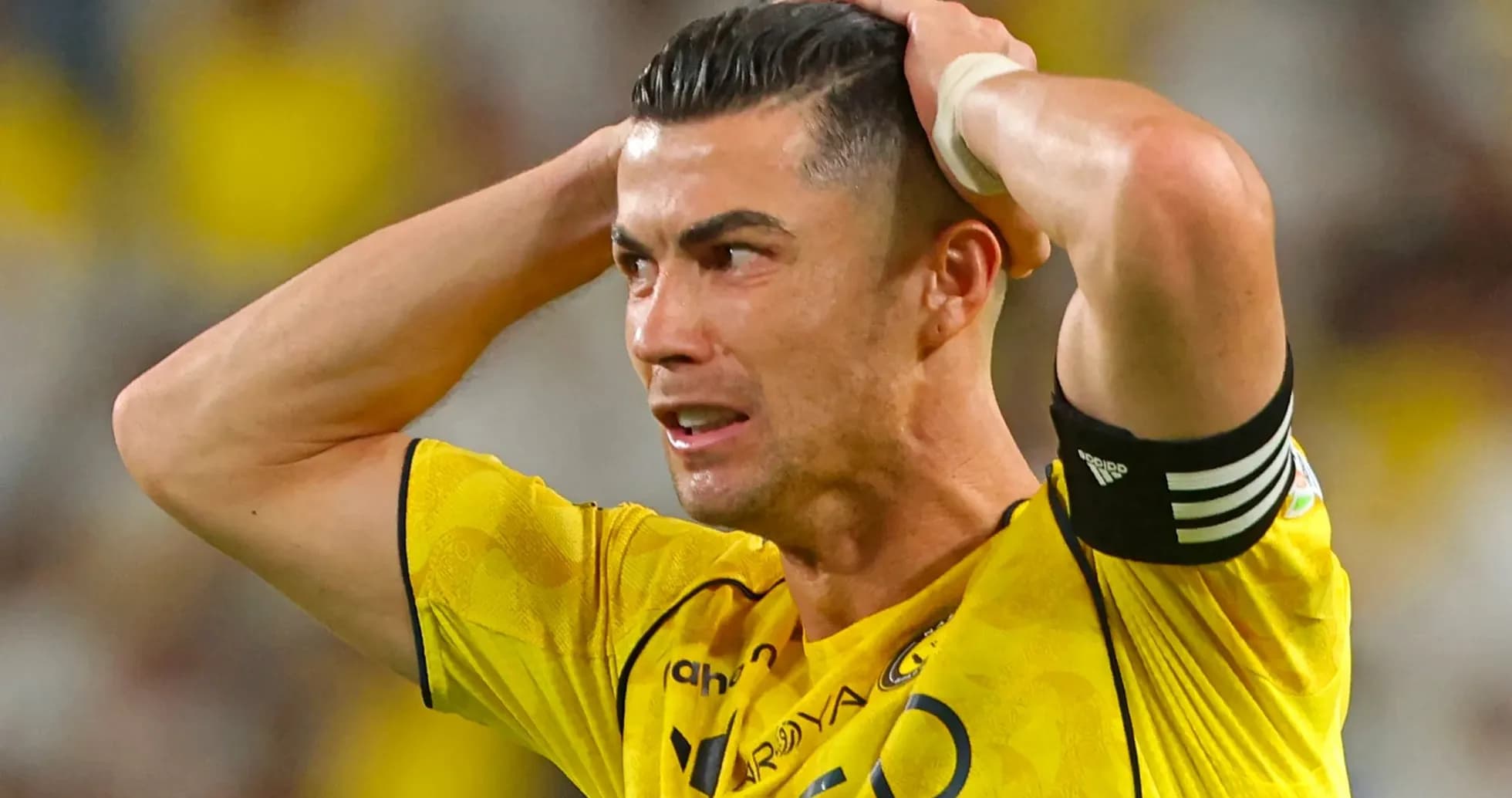 Player in yellow jersey showing frustration during match
