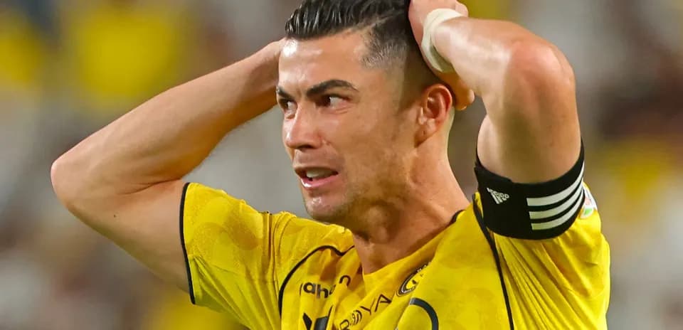 Player in yellow jersey showing frustration during match