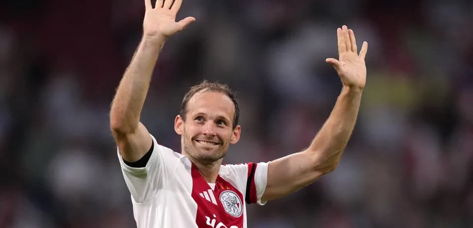 Player waving to fans in Ajax jersey