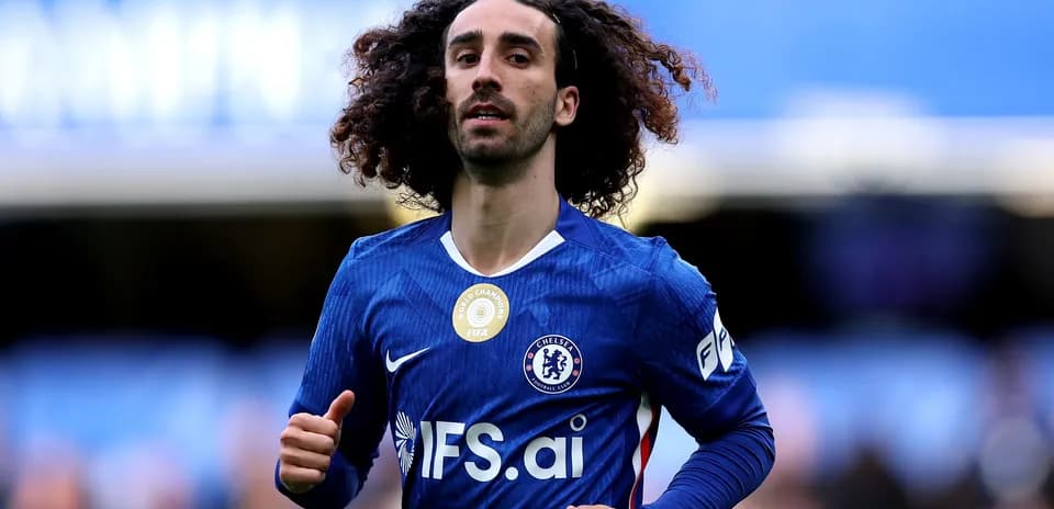 Player in Chelsea jersey running on the pitch