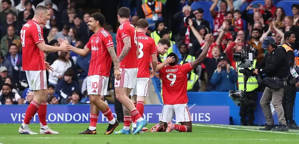 Players celebrating after a goal during match