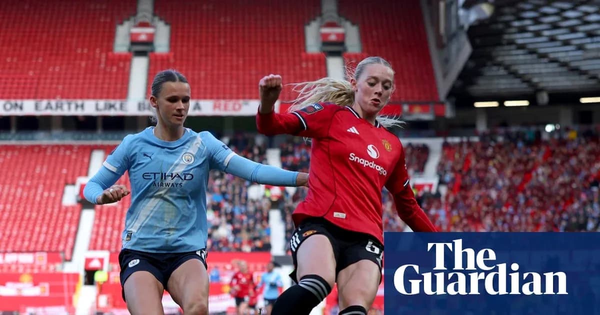 Players from Manchester City and Manchester United contesting the ball