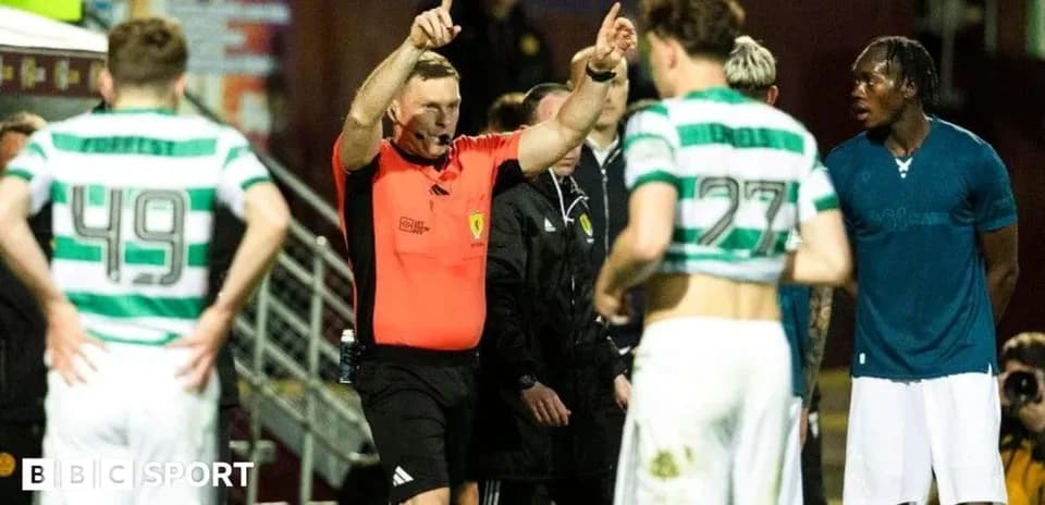 Referee discussing with players during match stoppage