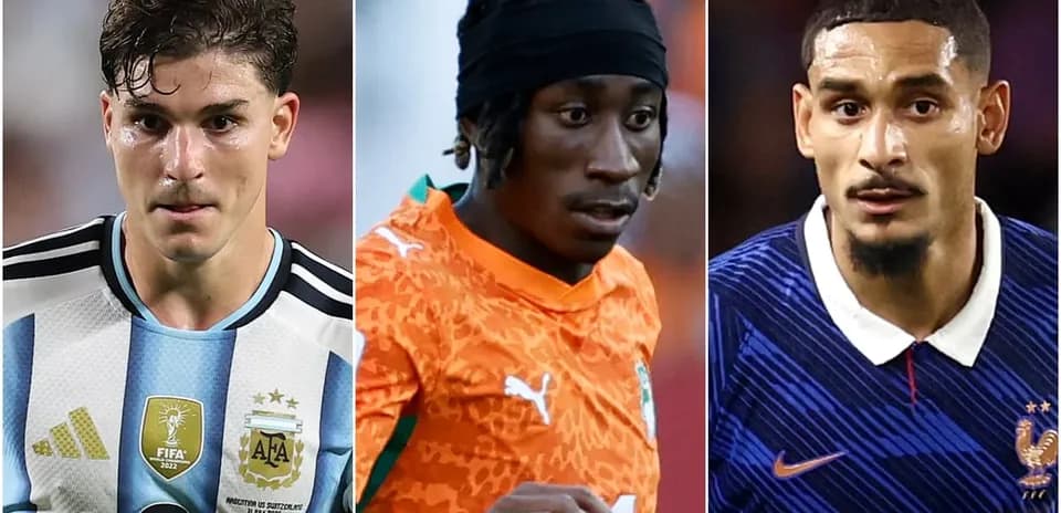Three soccer players in national team jerseys