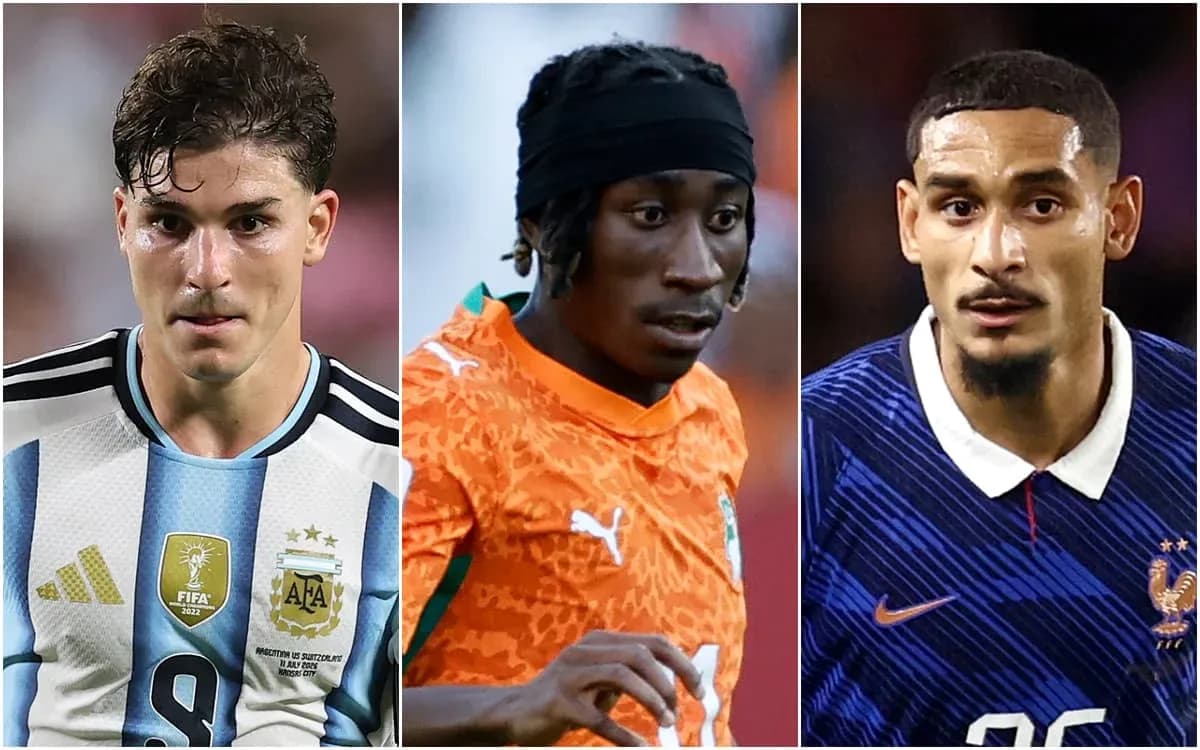 Three soccer players in national team jerseys