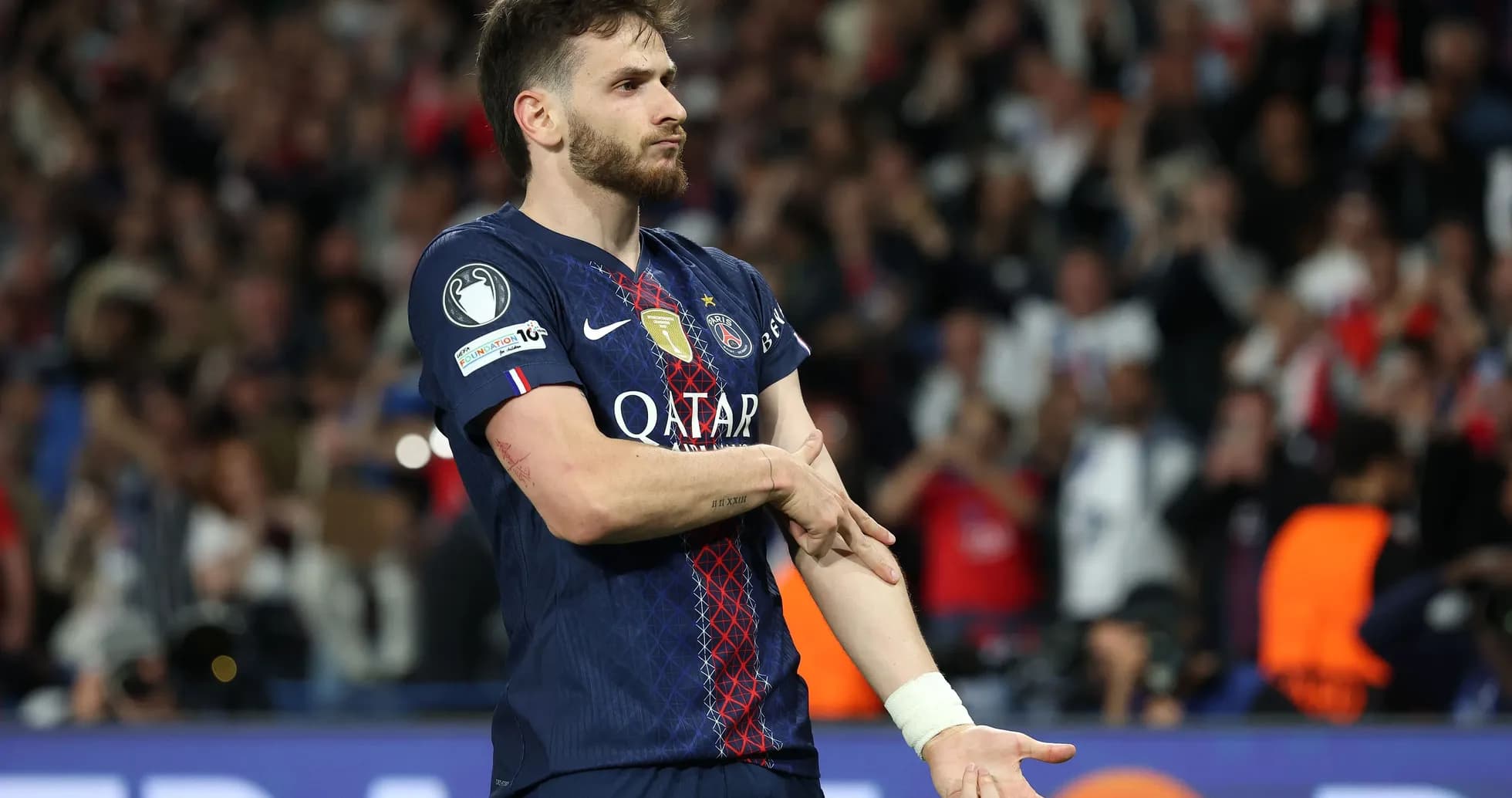Player celebrating during a match for PSG