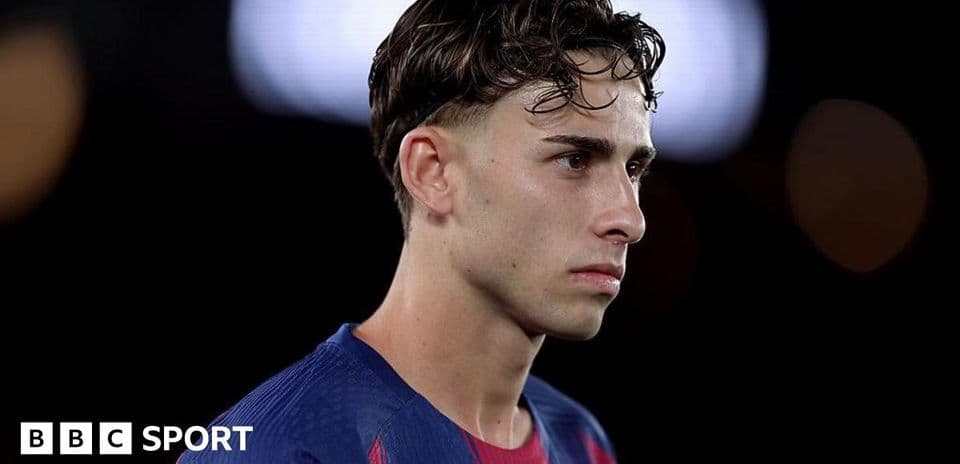 Player in Barcelona jersey during match contemplation